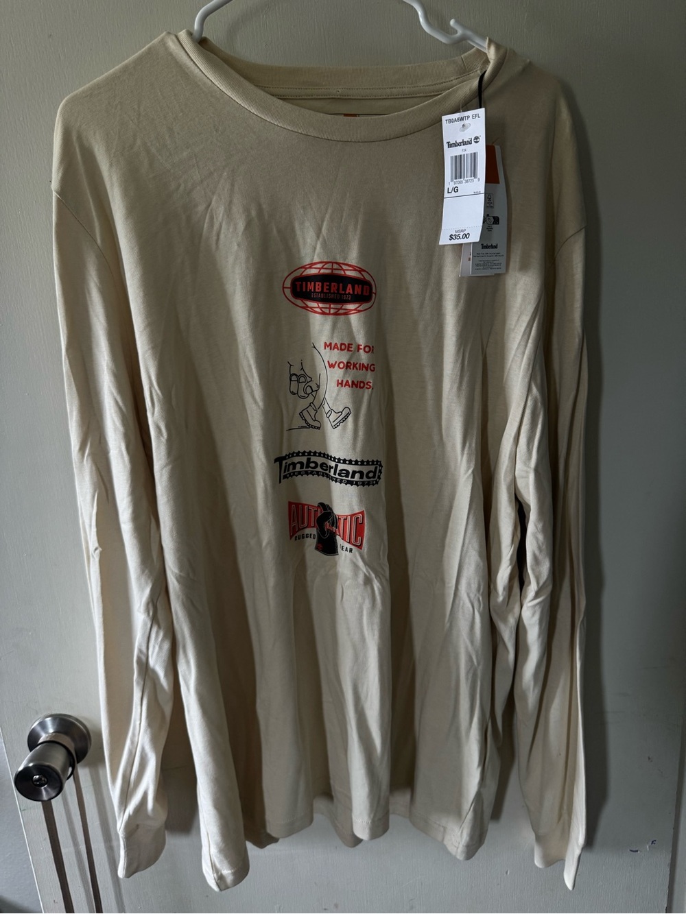 Timberland Beige Long-Sleeve Graphic Tee with Red Accents